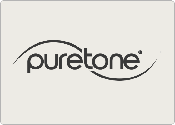 The Puretone wordmark sits on a pale background, framed by sweeping dark curves above and below its bold, rounded lettering.